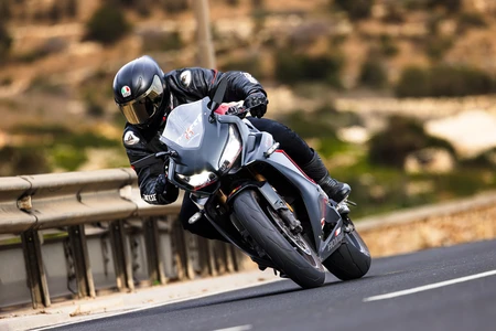 Motorcyclist on a Curved Road