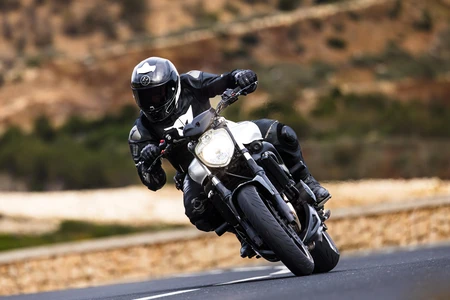 Motorcyclist on a Winding Road