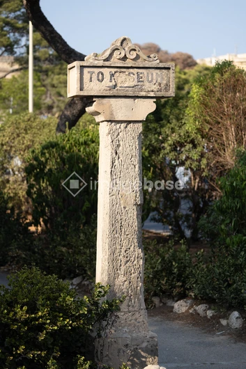 Ancient Stone Column in Garden