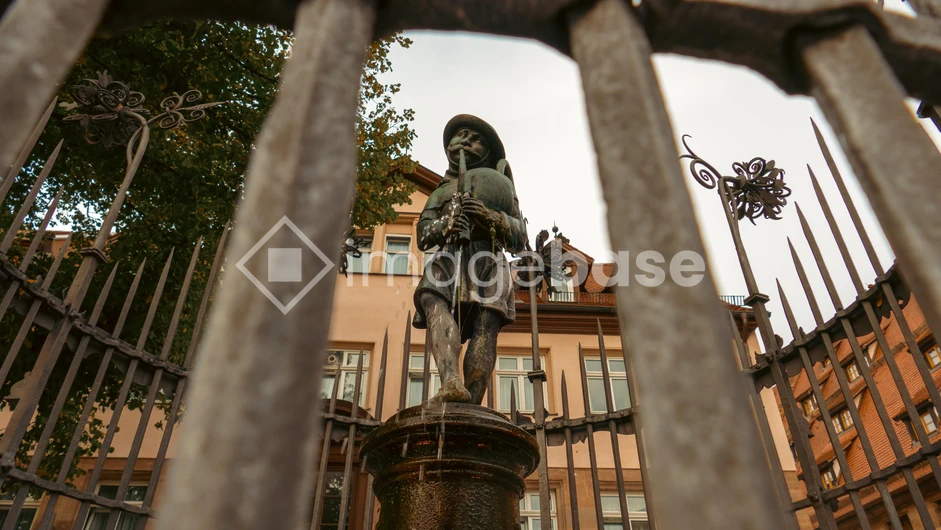 Historical Statue Behind Iron Bars